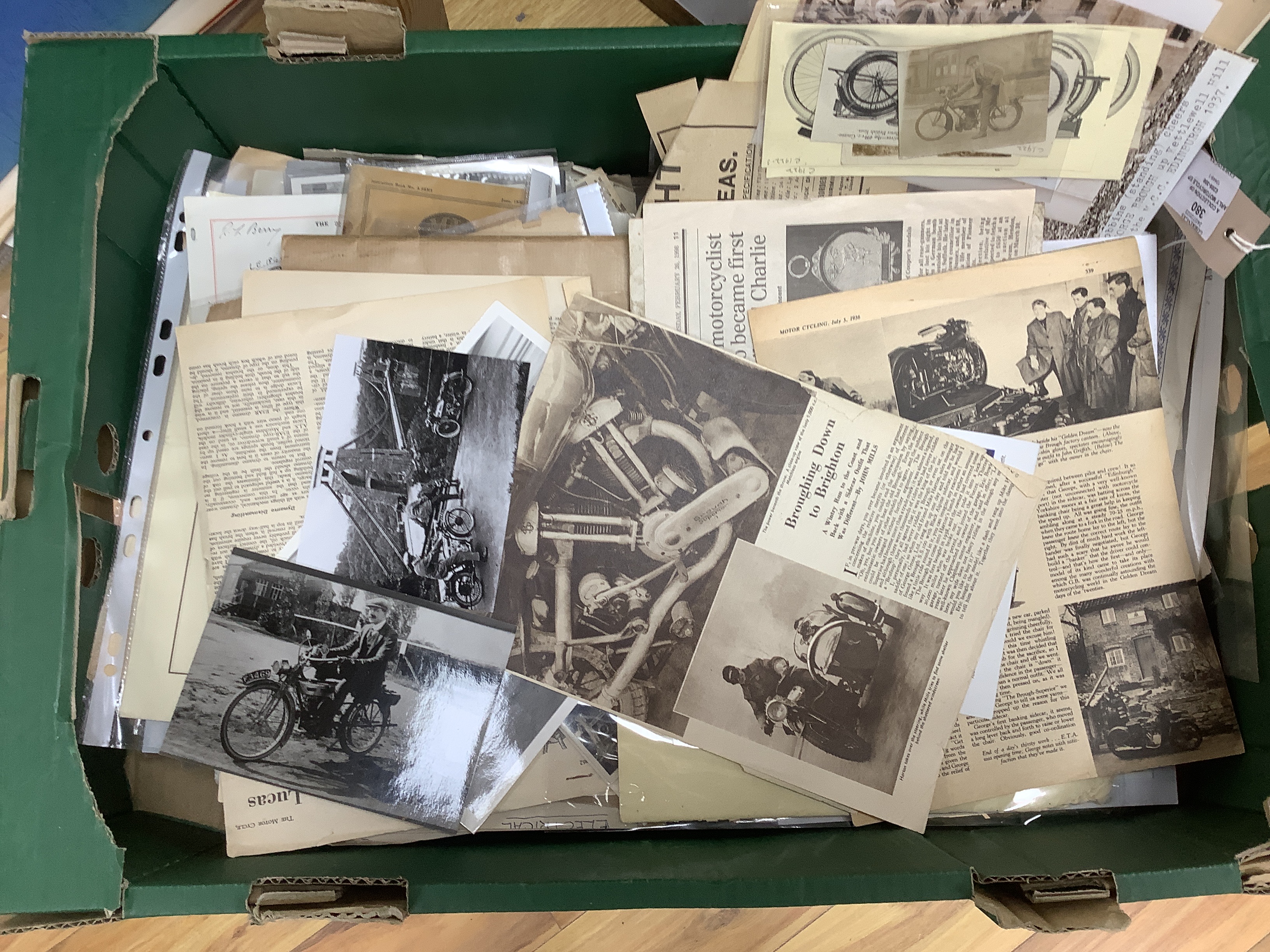 A collection of early motorcycle ephemera, postcards and black and white photographs